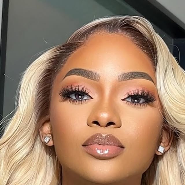 Close-up glam look with blonde waves and bold lashes