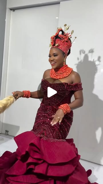 Editorial portrait with coral beads and regal makeup