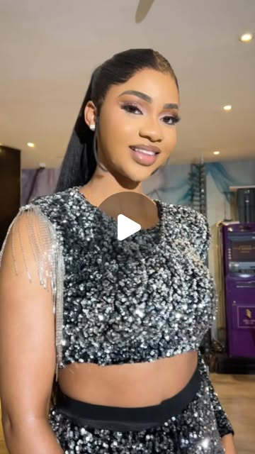 Editorial close-up with silver sequin outfit and sleek hair